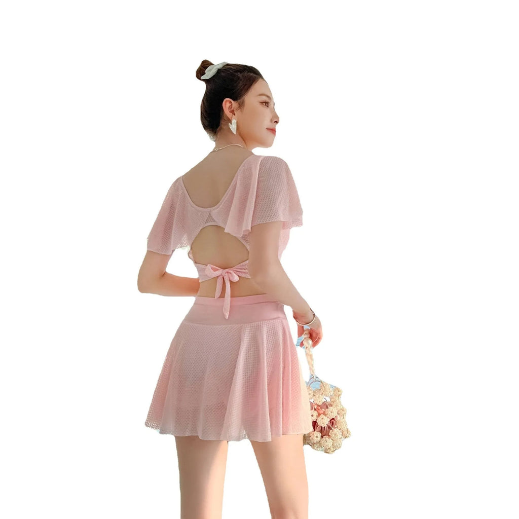 Women's two-piece skirt swimsuit in solid colour with separate top and skirt components