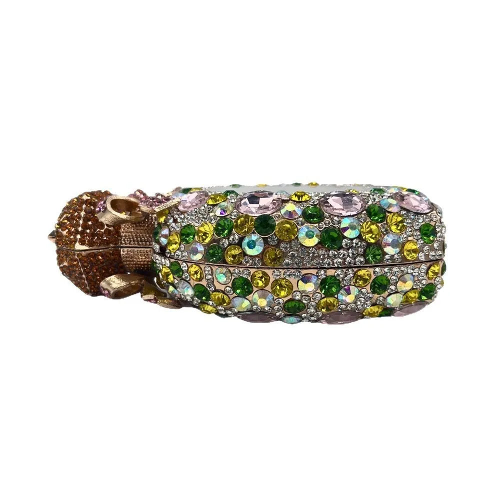 Golden women's hard shell clutch bag covered in sparkling diamonds for formal events.