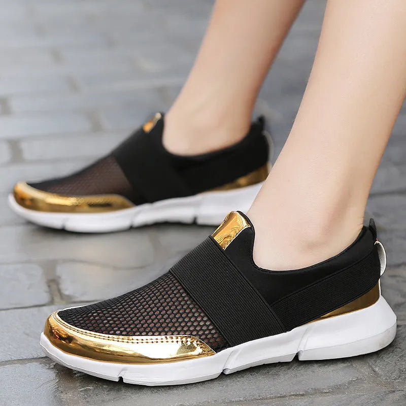 Blue low-top women's mesh sneakers with a colour-matching pattern on a light background.