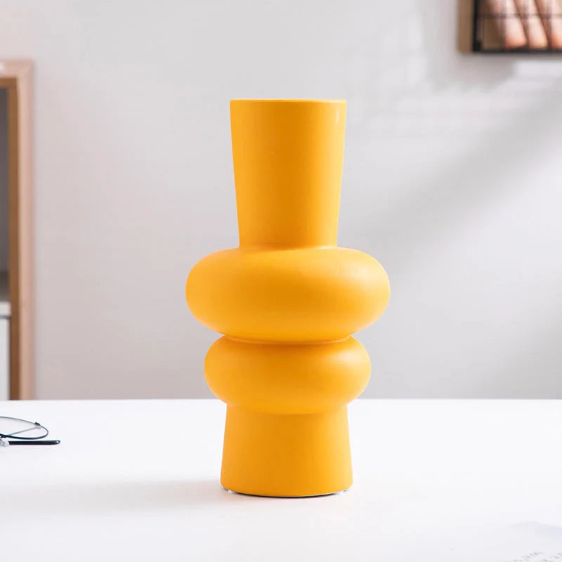 Nordic minimalist ceramic vase in blue, yellow, and orange with glazed finish