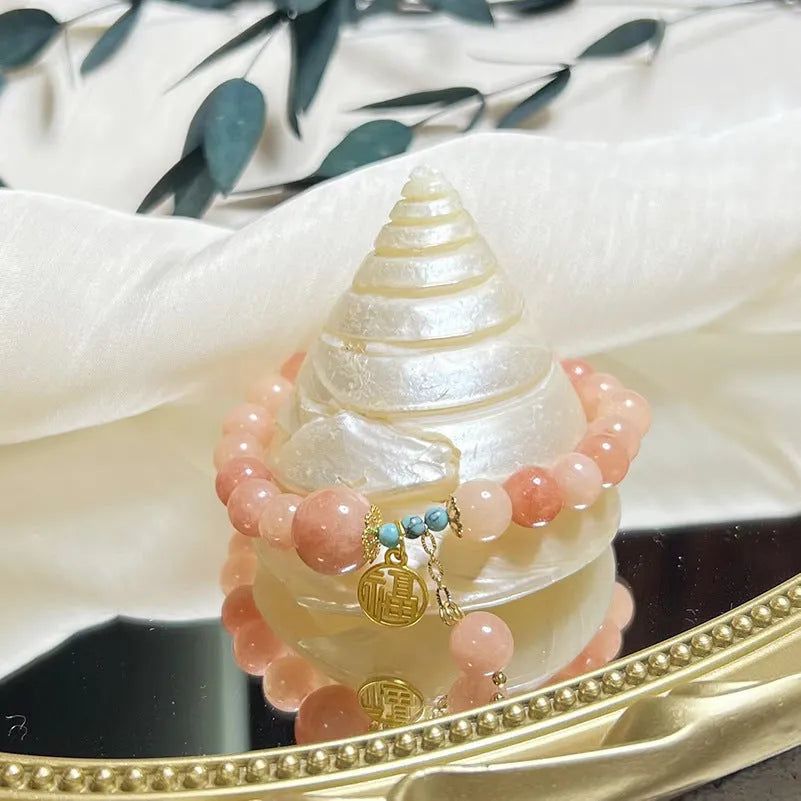 Women's pink natural stone bracelet with alloy metal setting and adjustable clasp