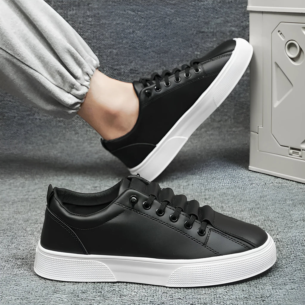Men's black and white low top sports shoes with mesh and synthetic leather construction