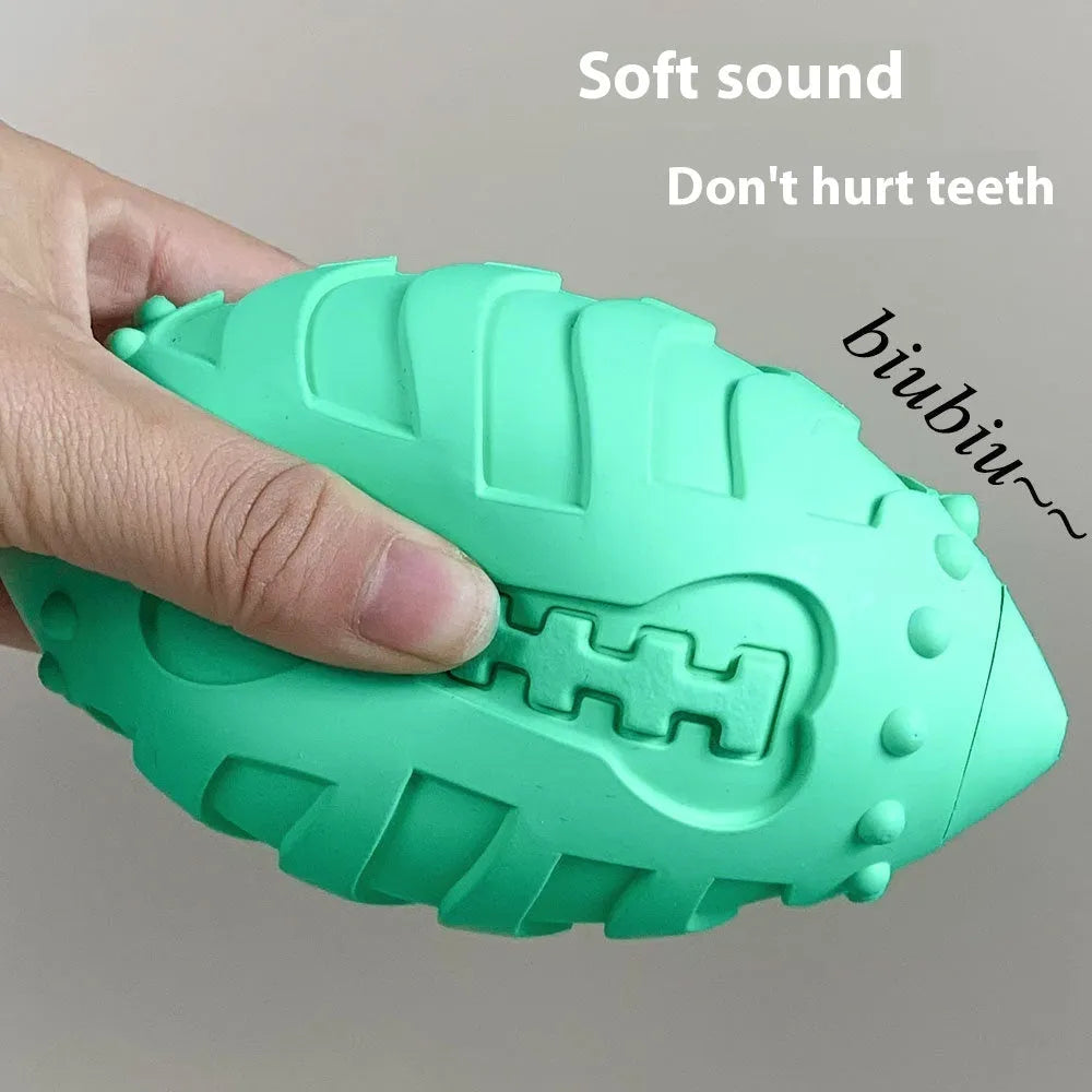 Thickened light green rubber rugby ball dog toy with vocal sound feature for chewing and interactive play.
