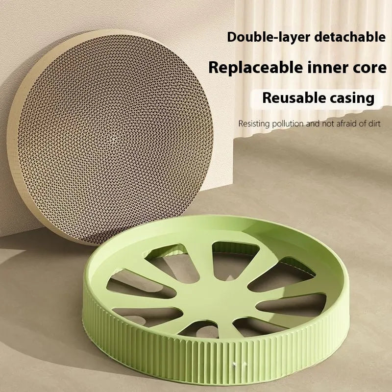A round green cat scratching board made of corrugated cardboard, 55cm across, with two spare refills.