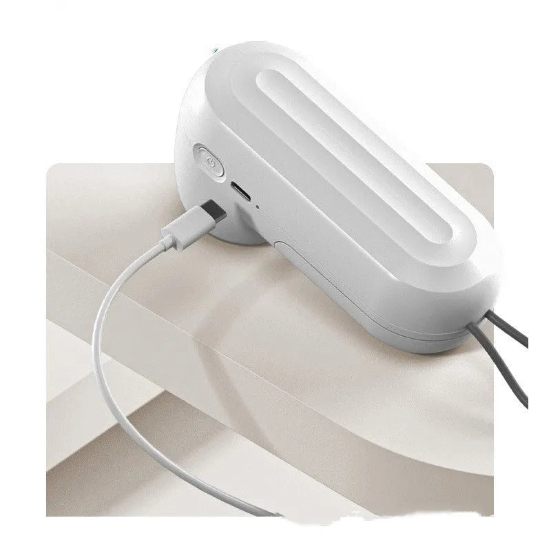 White ABS hand electric vacuum sealing machine with USB charging, compact size 54x63x132mm