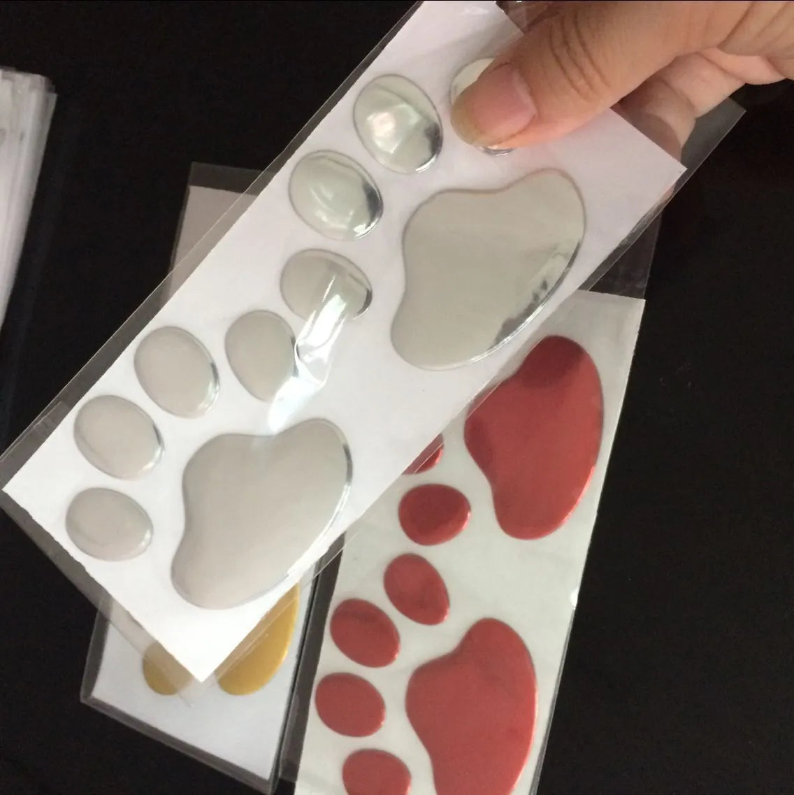 PVC car sticker with hand-shaped dog footprints design in multiple colours for vehicle bumpers