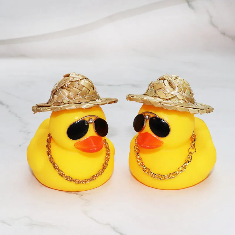 Yellow cartoon duck wearing a straw hat car decoration with adhesive glue and sunglasses accessory.