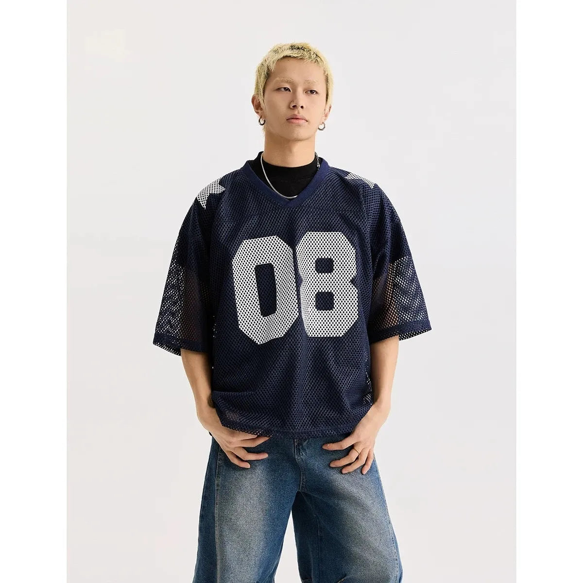 Black loose fit half sleeve pullover shirt with white letter print pattern.