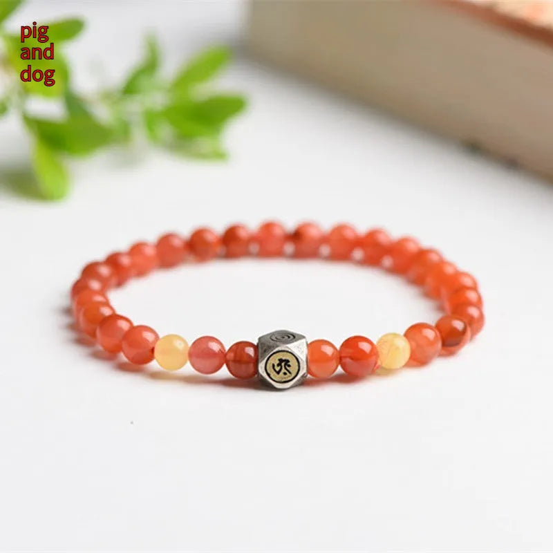 Natural red Nanhong agate and amber beeswax bead bracelet on a string, with zodiac constellation design.