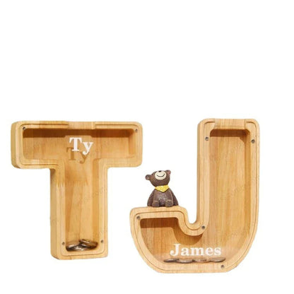 Unique wooden coin bank in the shape of a letter, featuring a clear glass display to watch savings grow