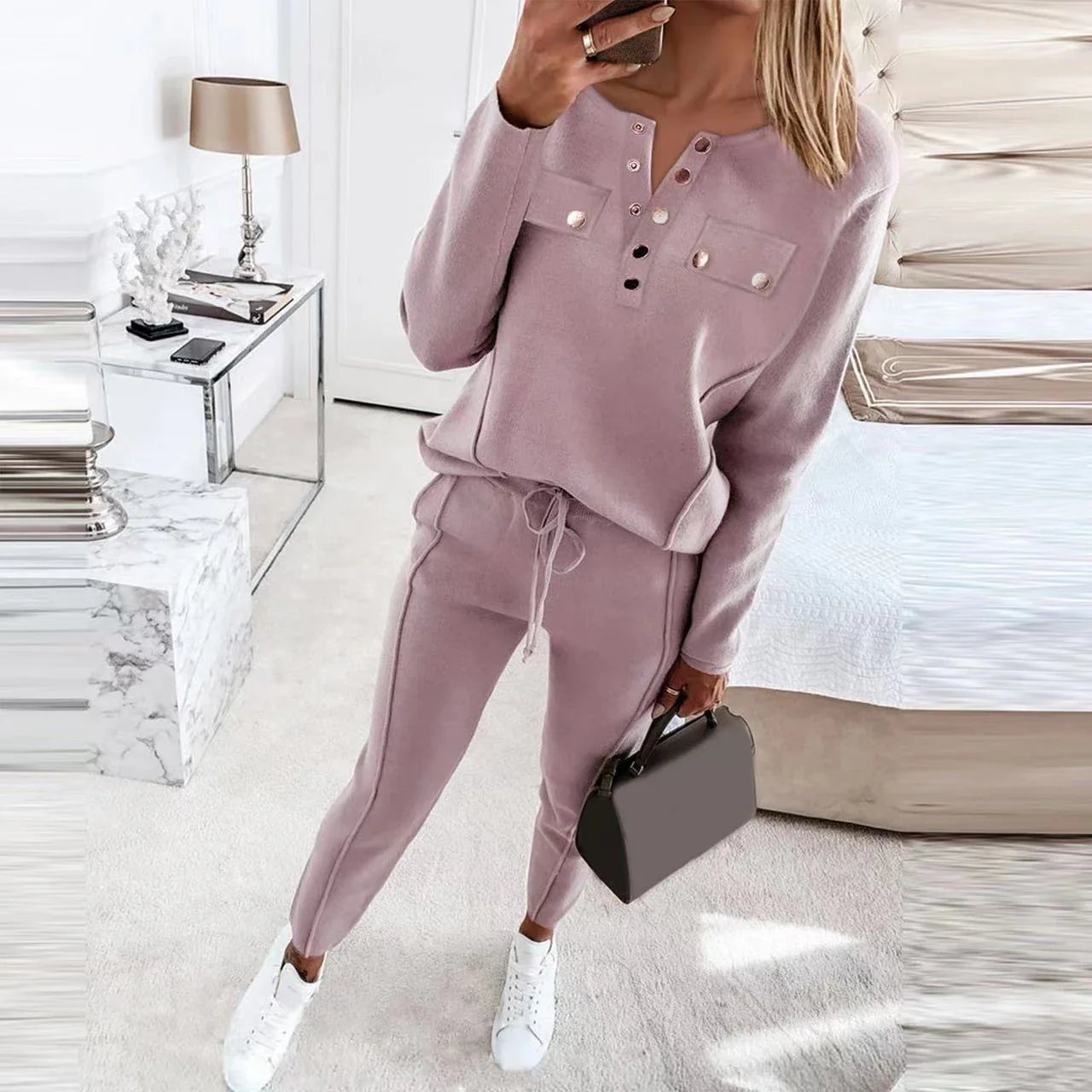 Cozy and stylish two-piece loungewear set with a cotton-blend sweatshirt top and matching drawstring pants