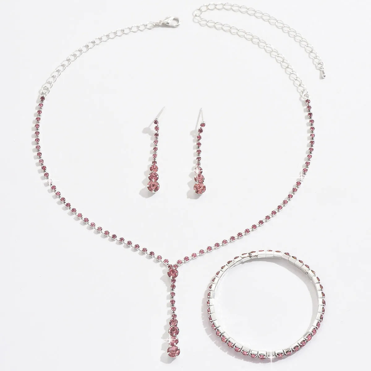 Bridal jewellery set with rhinestone heart necklace, elastic bracelet, and matching earrings with tassel details