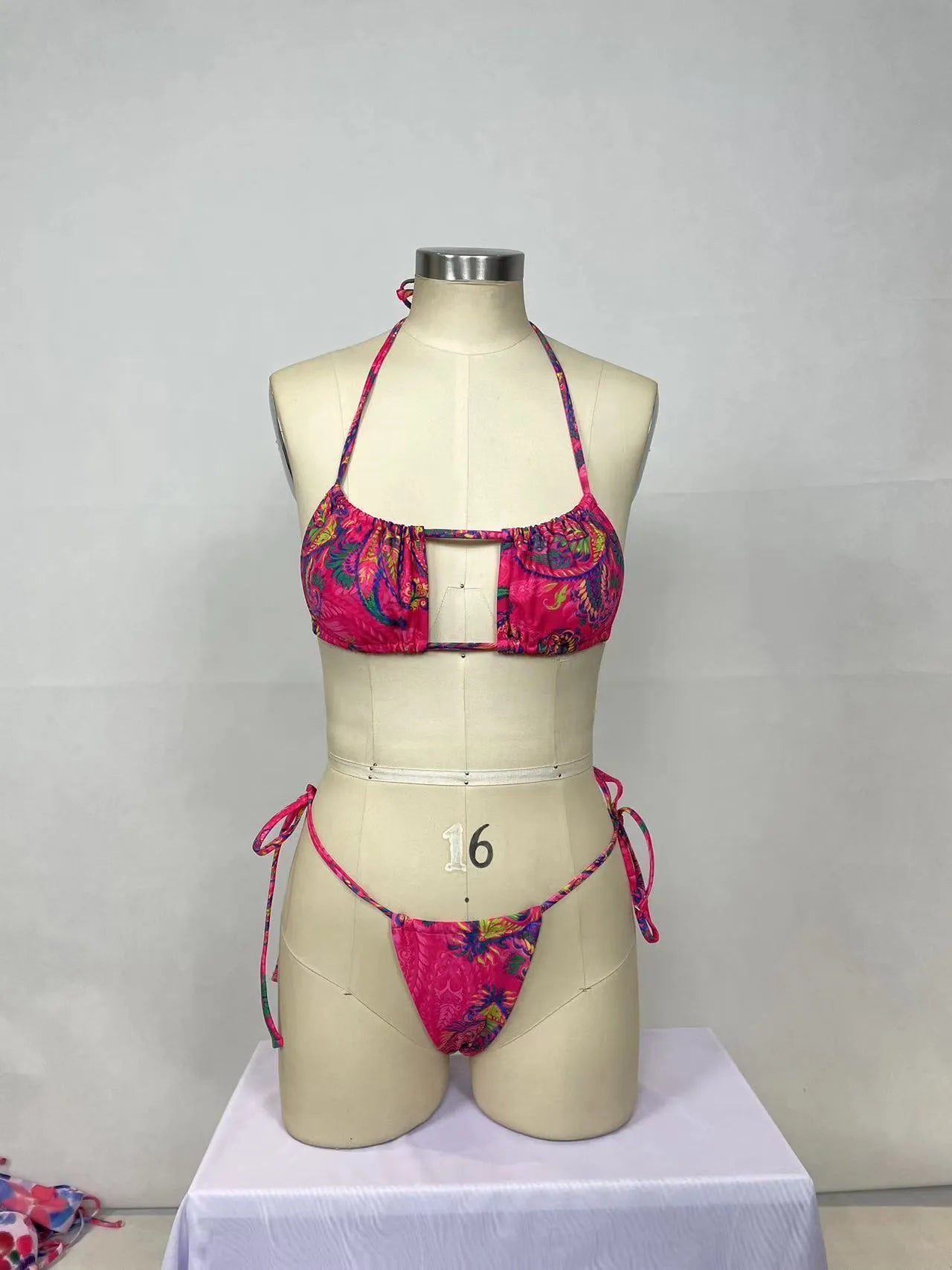 Pink printed women's bikini two-piece set with sleeveless backless design