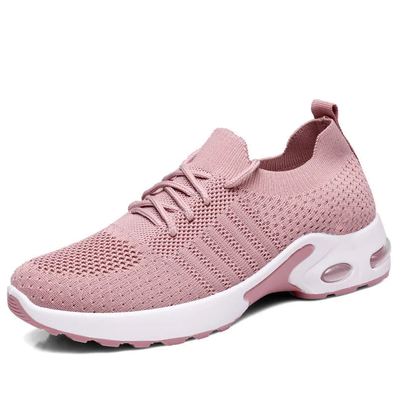 Women's casual mesh sneakers in black with round toe and lace-up front, showing PVC sole