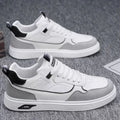 Men's low-top canvas sneakers in black with mesh lining and leather stitching detail.