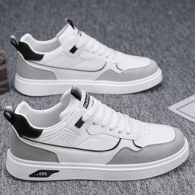 Men's low-top canvas sneakers in black with mesh lining and leather stitching detail.