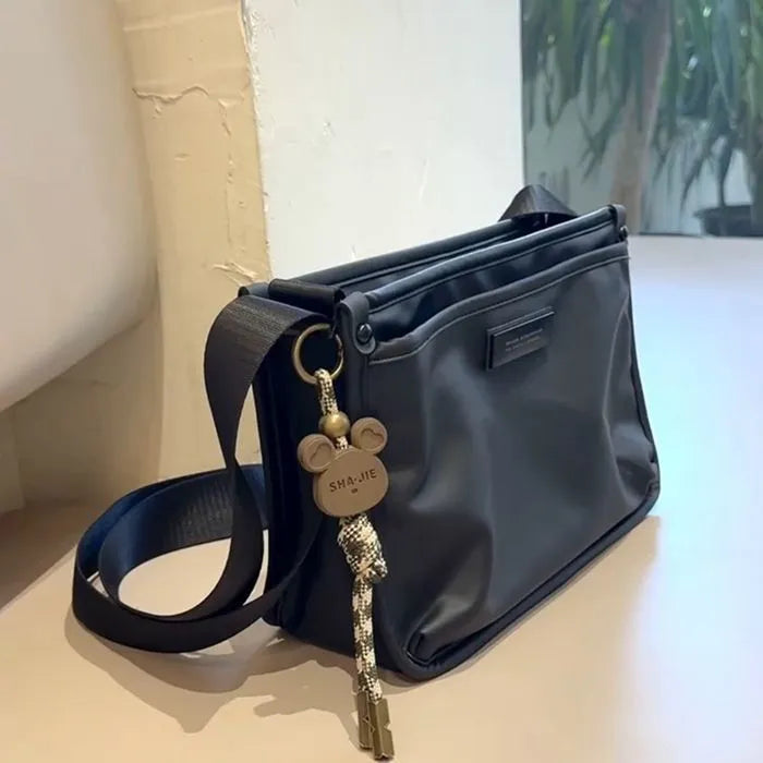 Small square crossbody bag in trendy cool colour made from Oxford cloth with shoulder strap