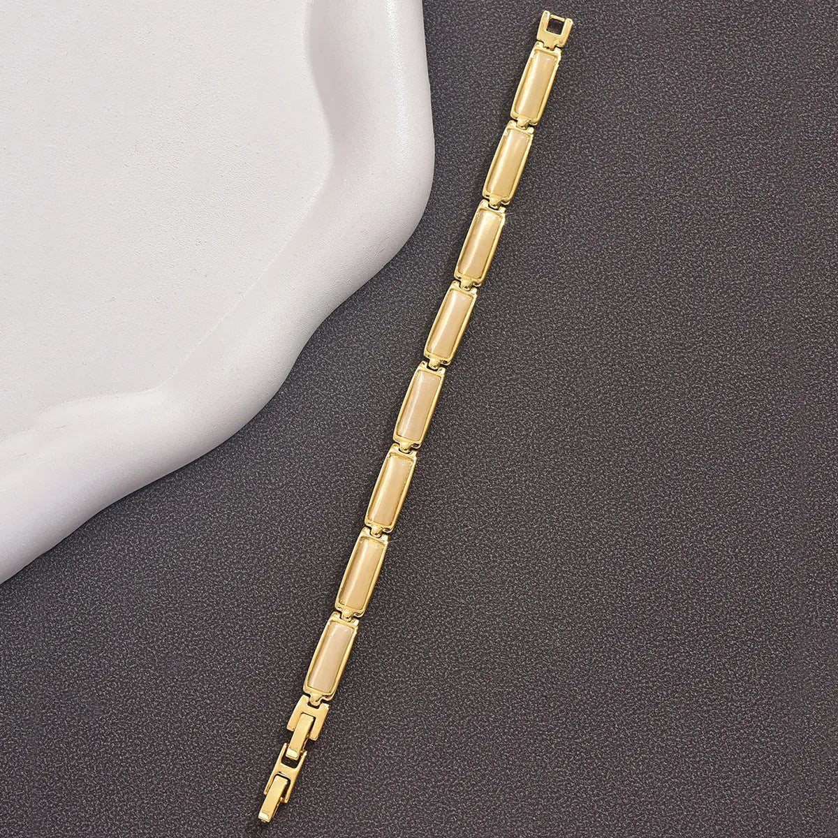 Geometric rose gold opal bracelet for women with quadrilateral alloy frame and gemstone inlay