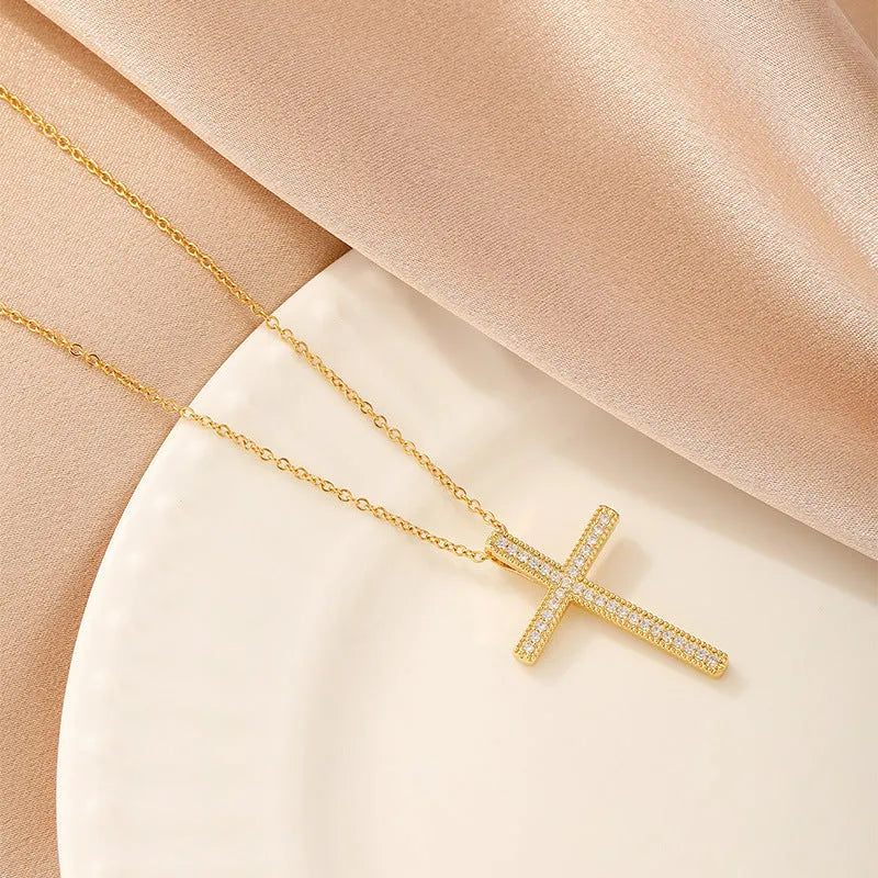 Women's copper electroplated necklace showing heart, round diamond, butterfly, and cross pendant shape options.