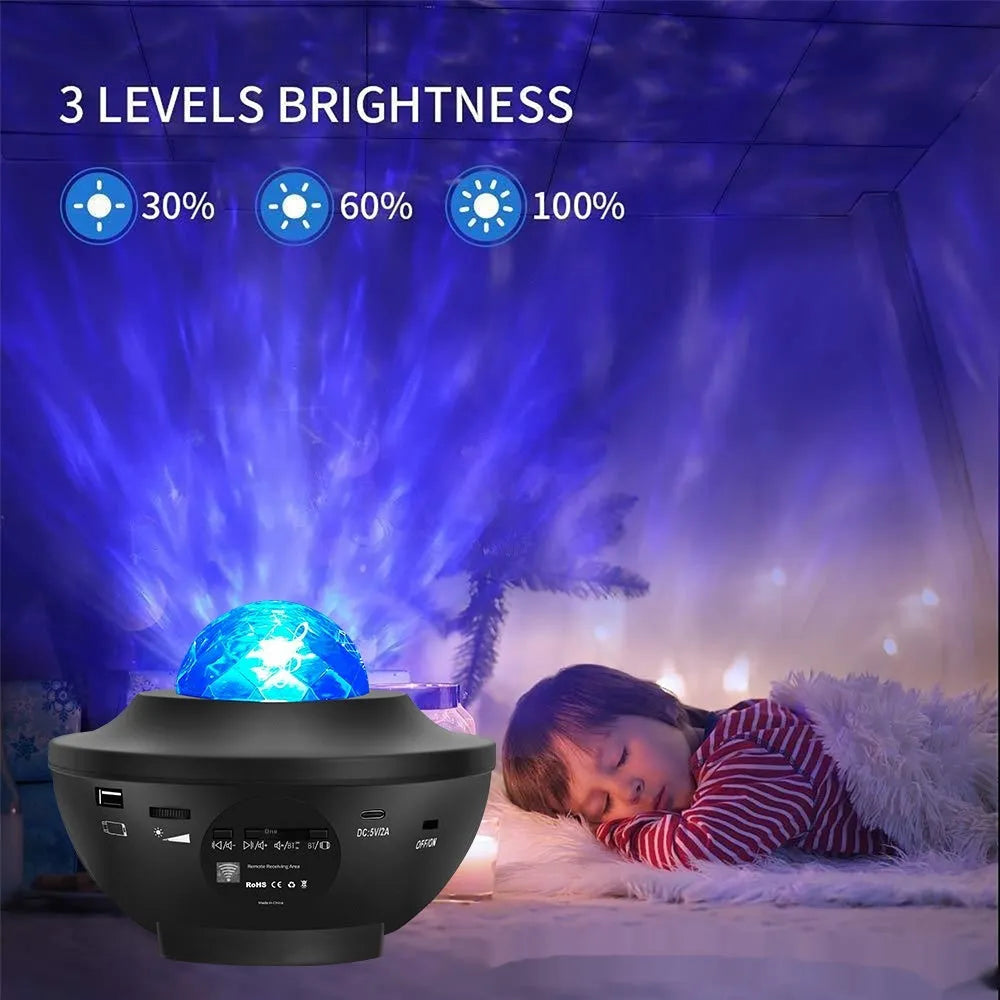 Black Bluetooth starry sky projection lamp with rotating water ripple laser effects on desktop