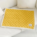 Blue quilted cloth pet blanket for cats, shown with size options M, L, and XL next to a cat bed.