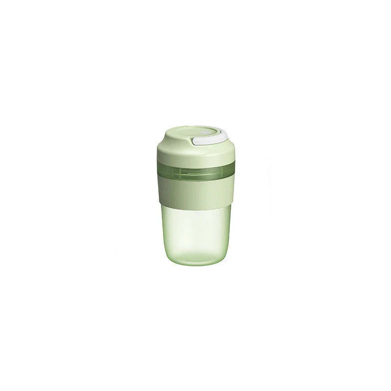 Rechargeable personal blender bottle with 4 stainless steel blades for making smoothies and shakes on the go