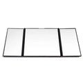 Silver car folding grooming mirror shown opened and closed on a car dashboard.