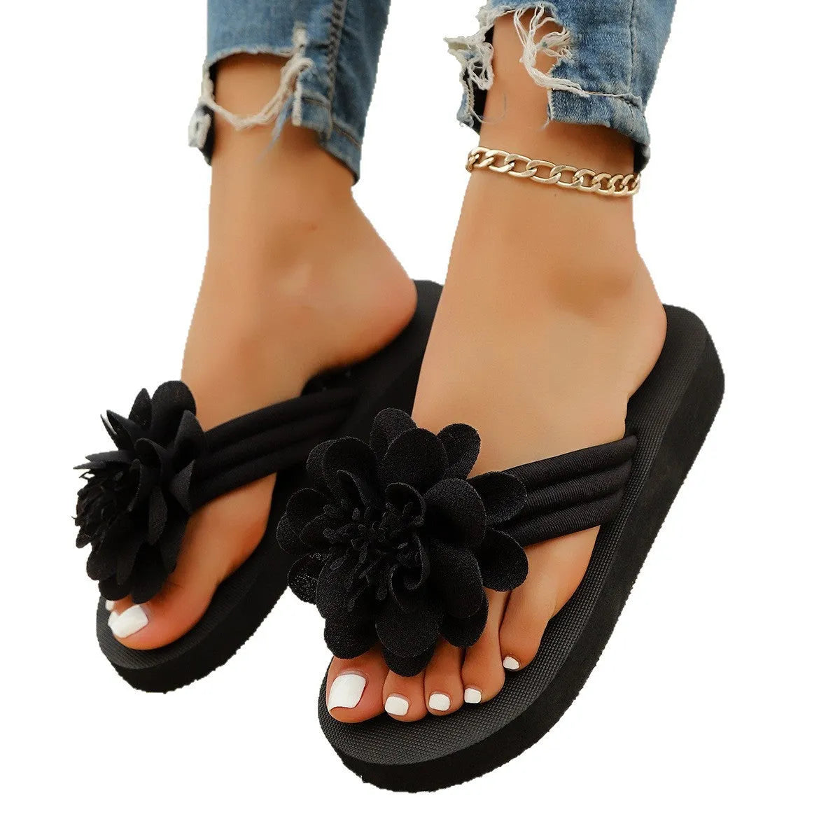 Casual beige flip-flops with a floral pattern on the straps and a light-coloured EVA sole.