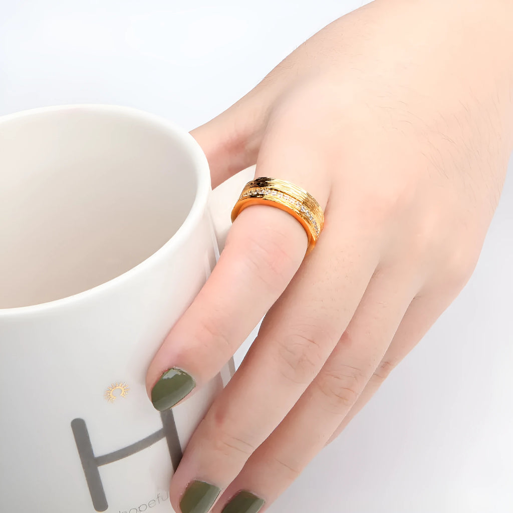 Geometric gold-colour women's ring in copper with electroplated finish, shown in sizes 6, 7, 8
