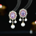 Oval geometric copper earrings with zircon inlays and pearl tassel drops in light purple colour