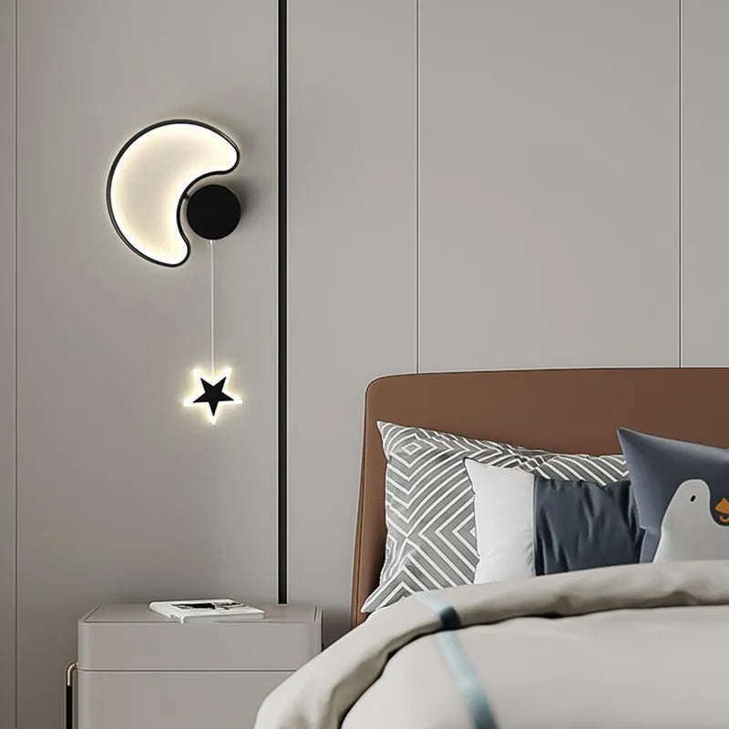 White cloud-shaped children's wall lamp with LED light mounted beside a bed.