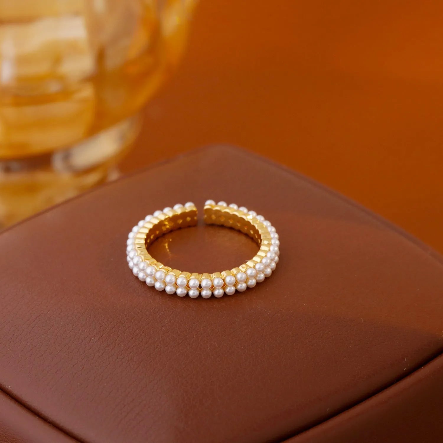 Gold geometric women's ring with open mouth design and round pearl element