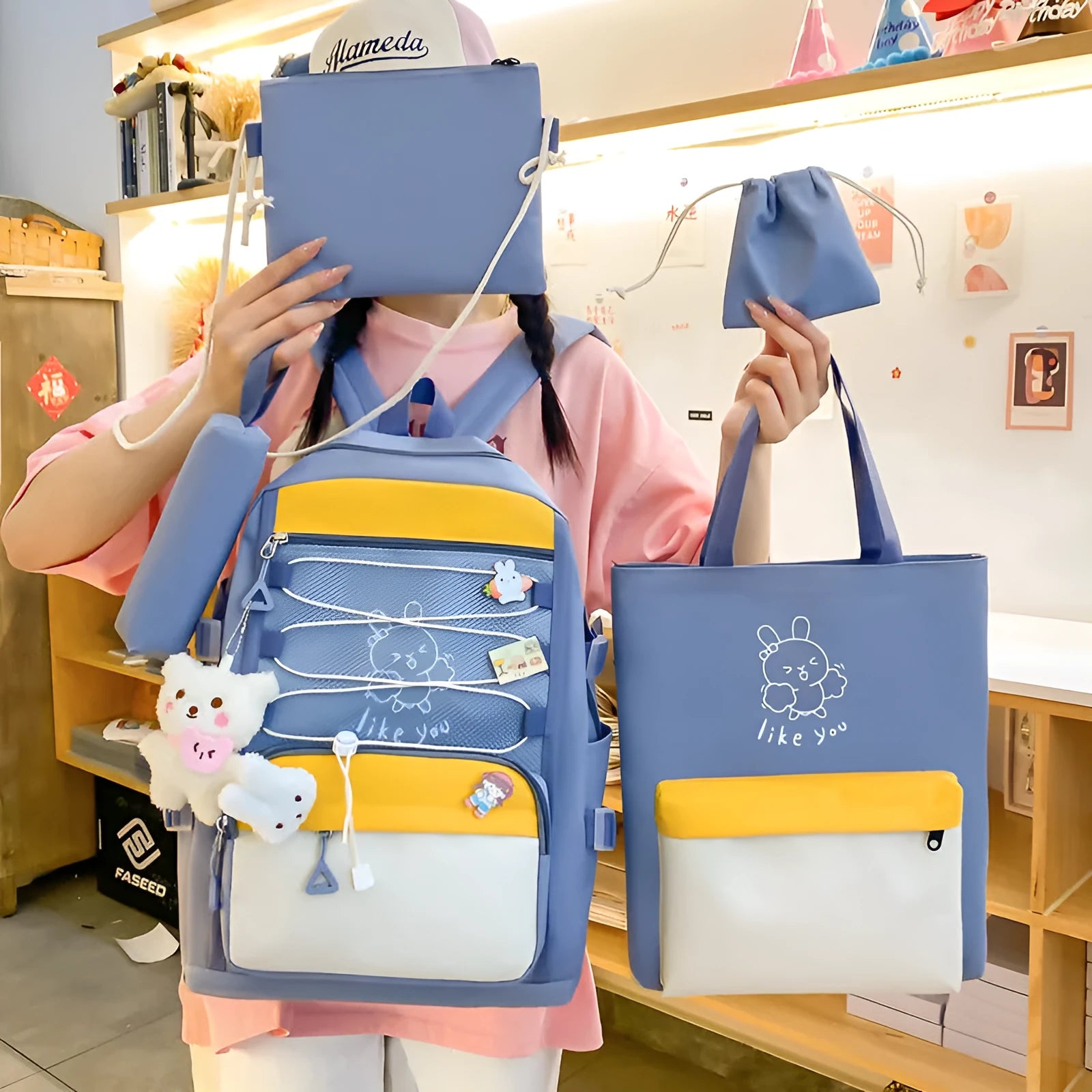 Lightweight large capacity student backpack in nylon, showing curved shoulder straps and solid colour options.