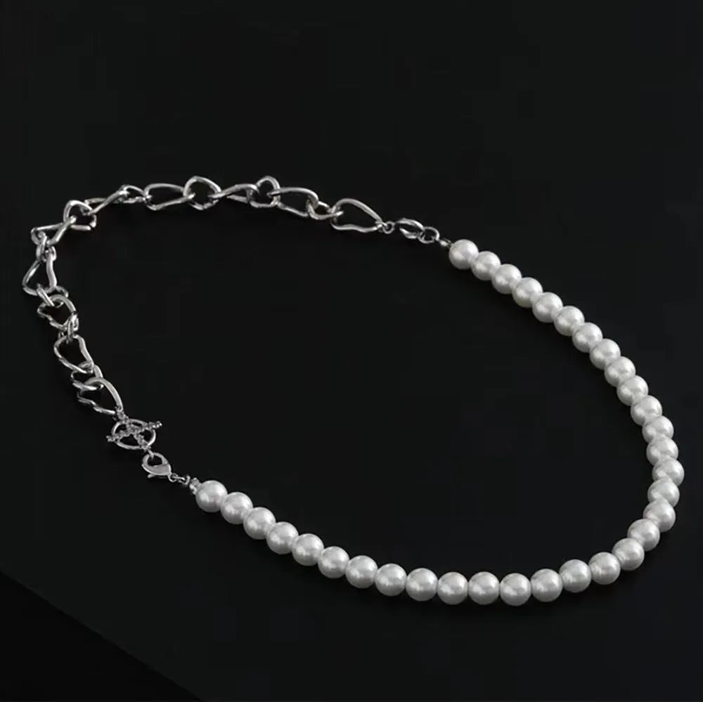 White geometric asymmetric acrylic pendant necklace on a twisted chain.