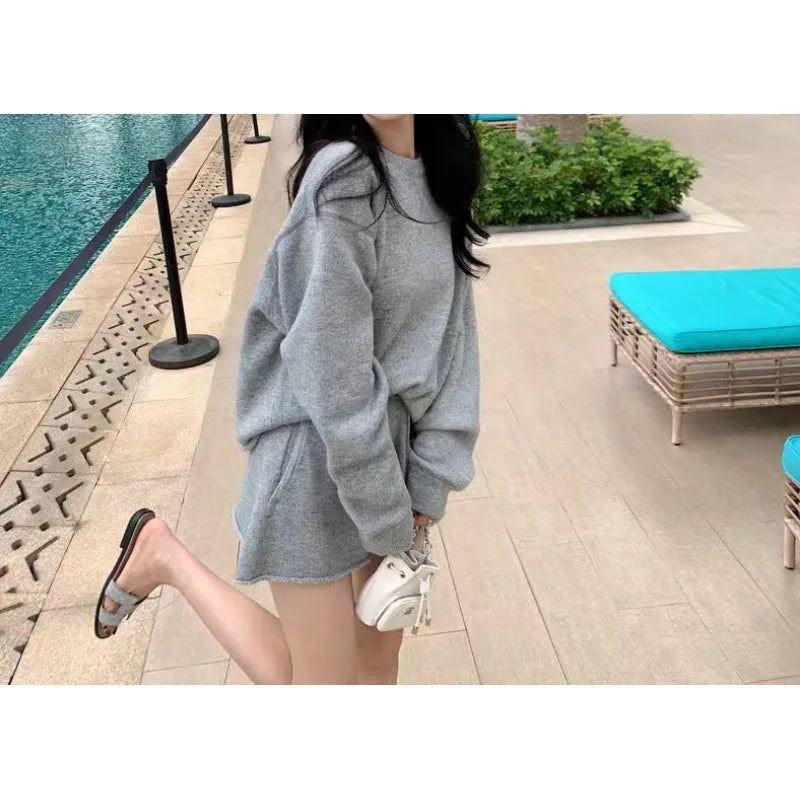 Women's loose-fit acrylic knit sweater and wide-leg shorts co-ord set in oatmeal colour.