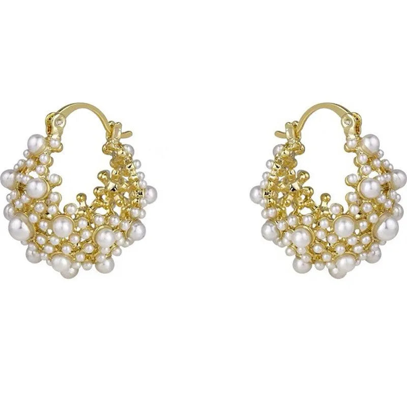 Gold-coloured copper flower basket earrings with small rice-shaped beads and pearl inlay details