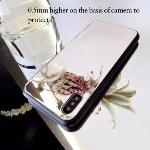Black iPhone mirror phone case with reflective back cover for iPhone X and other models.