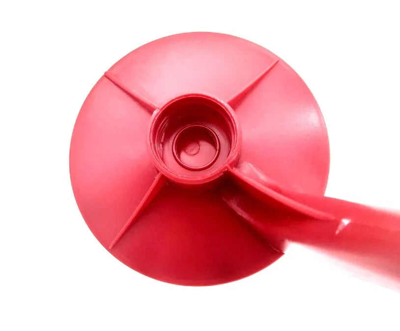 Red plastic Magic Tap soda dispenser for 2-liter bottles with push-button mechanism
