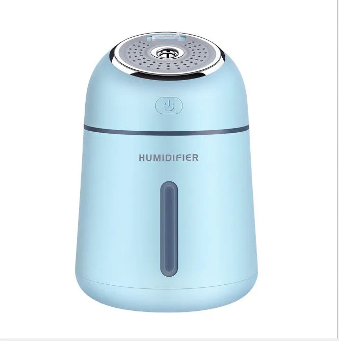 Mini ultrasonic humidifier 330ml four-in-one USB with LED light and fan in blue, pink and white on desk