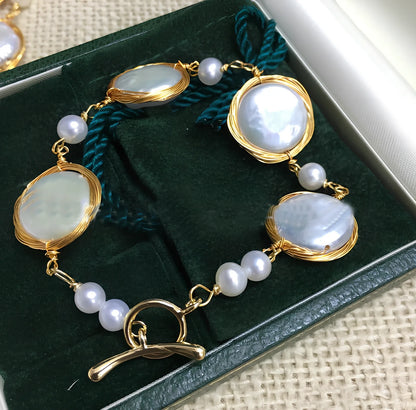 14K gold bracelet with 14mm white button freshwater pearls and baroque texture