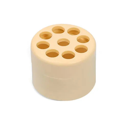 Plastic spiral stem bracket flower arrangement tool in green, with spiral design for holding stems in a vase