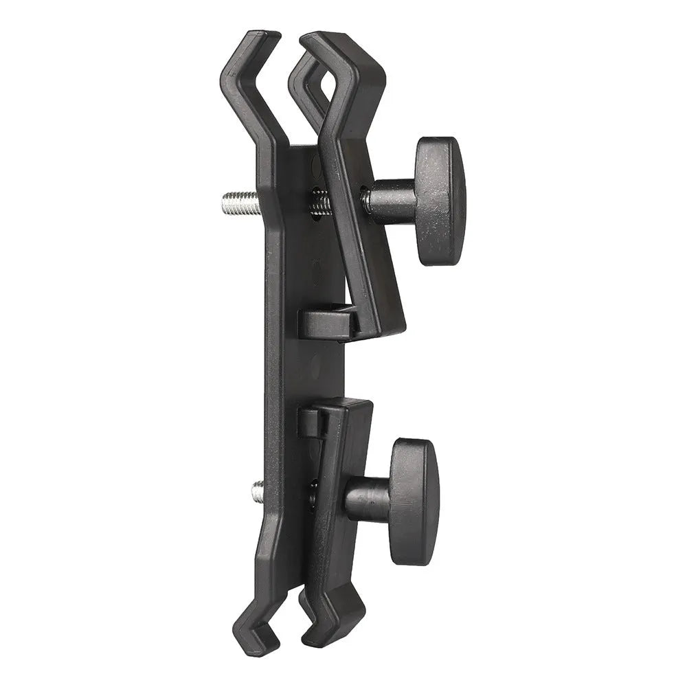 Black ABS plastic umbrella clip attached to a camera tripod shaft holding a compact umbrella.