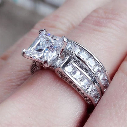 Silver charm couple rings with princess cut CZ, perfect for anniversaries, promises, or engagements