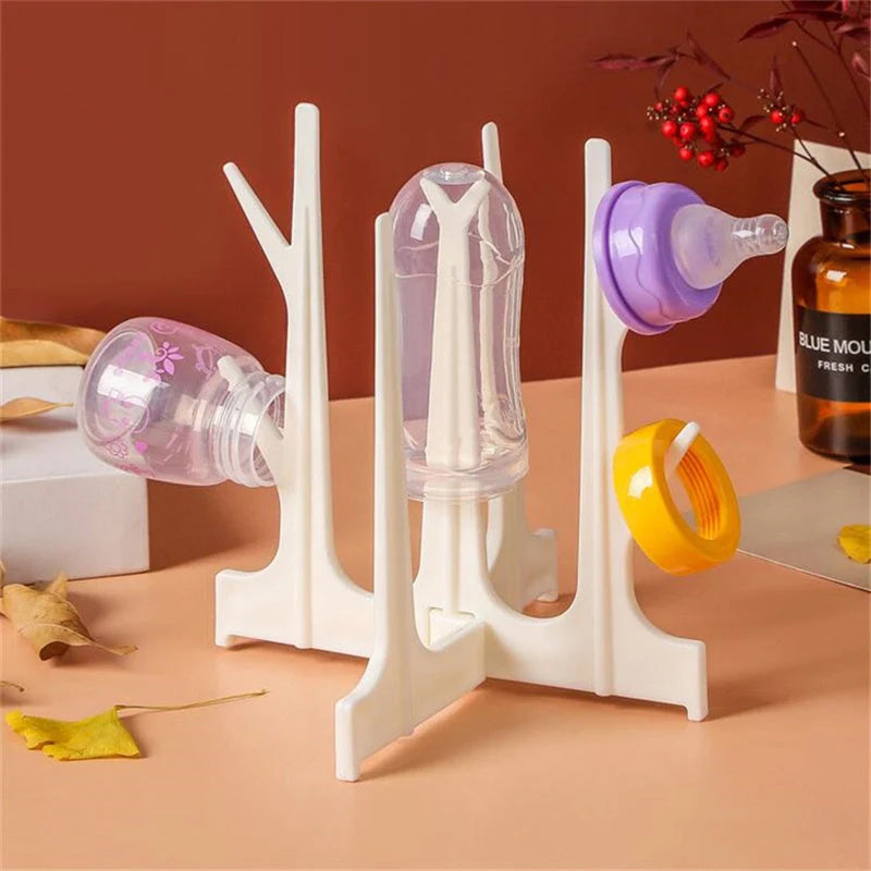 Creative tree branch design baby bottle drying rack in blue, yellow, white, and nude colours
