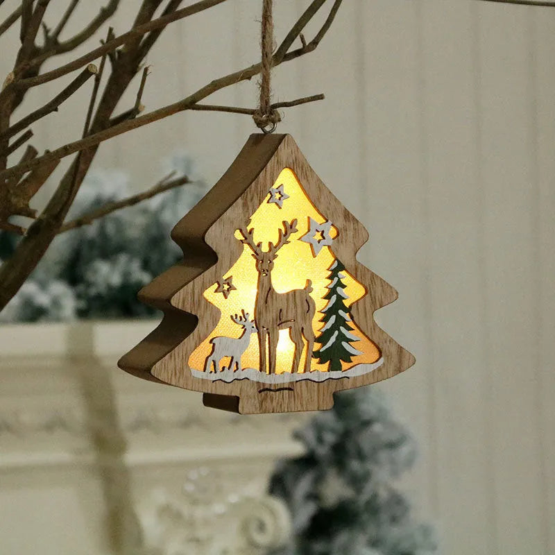 Set of four laser-cut wooden Christmas tree-shaped decorations including old man, snowman, deer, and five-star snowman in polychromatic colours