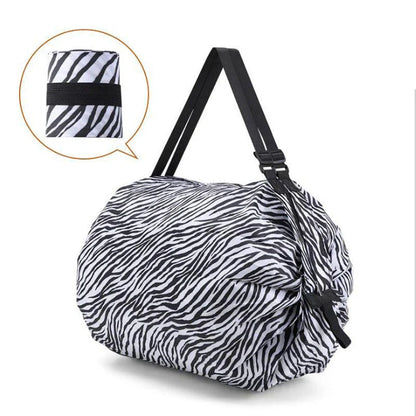 Foldable tote bag made of durable 210D Oxford cloth, featuring a versatile design that transitions from compact to spacious for everyday use in the United States