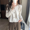 Women's long-sleeved acrylic cardigan coat in milky white, available in four other colours.