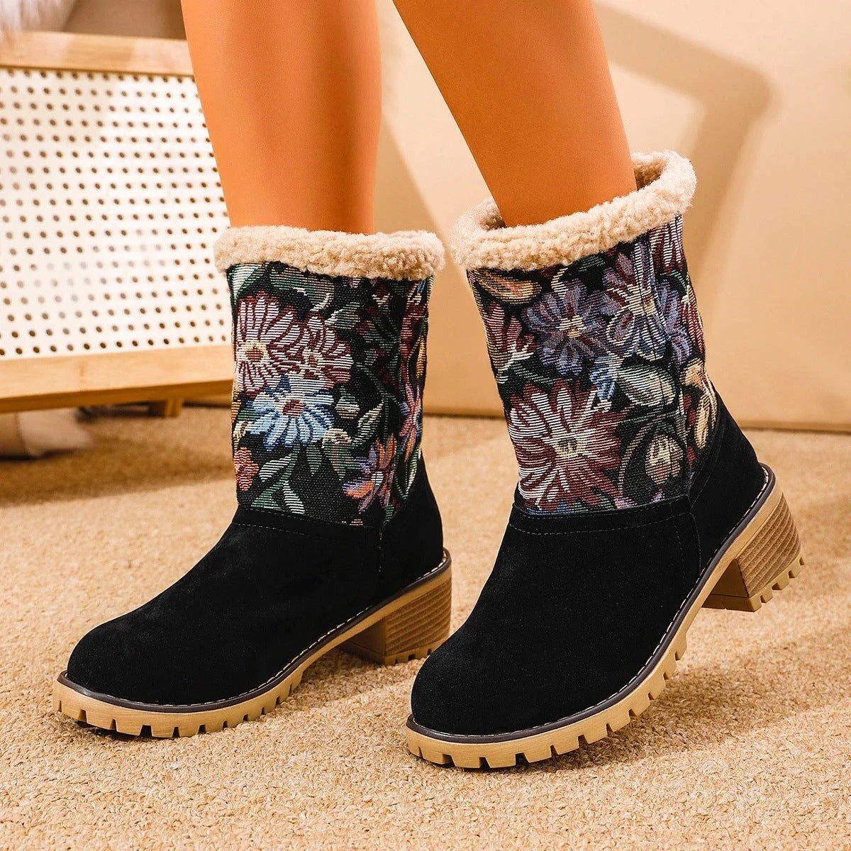 Stylish ethnic-inspired snow boots with floral embroidery, featuring a warm cotton interior and durable suede exterior in a variety of colors.