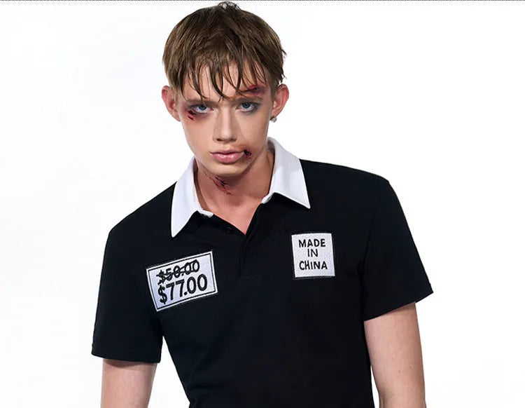Black slim fit men's polo shirt with embroidery detail on the chest, featuring short sleeves and a polo collar.