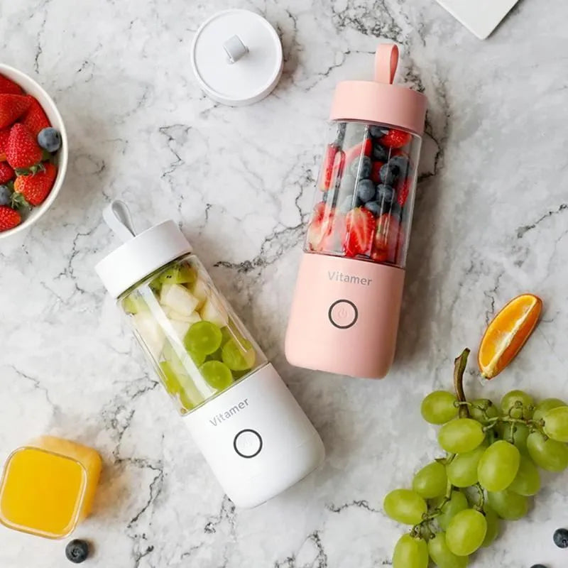 White portable USB rechargeable blender bottle with silicone handle and stainless steel blade.